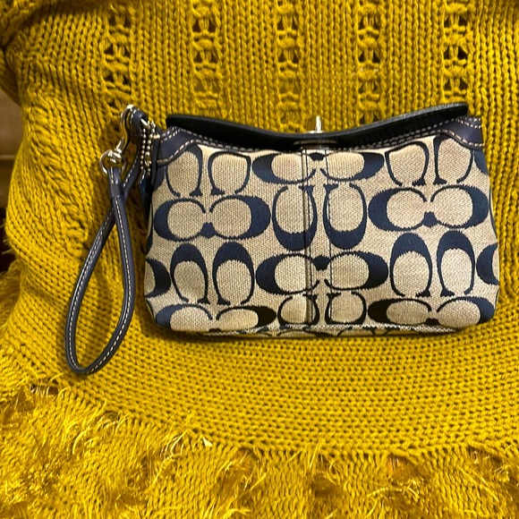 Coach Handbags - Coach wristlet clutch in navy and gray.